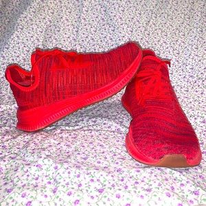 Red Puma training shoes